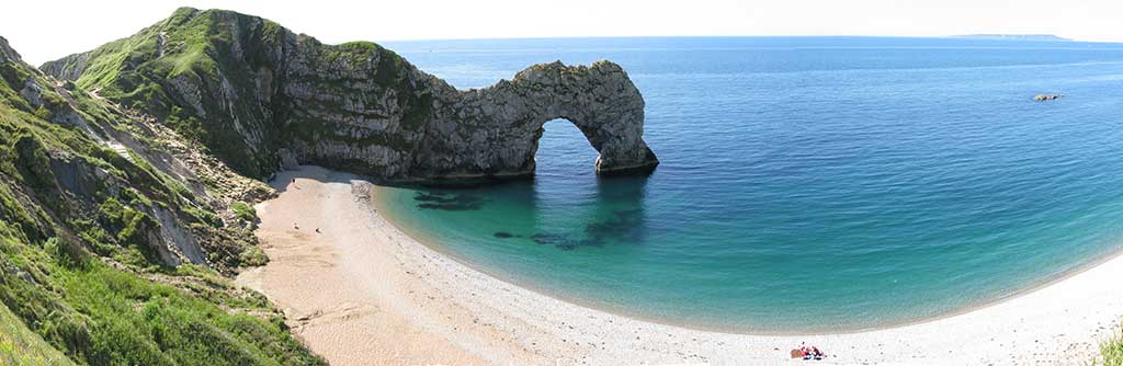 This is a panoramic view of the famous Durdle Door arch and the beach.