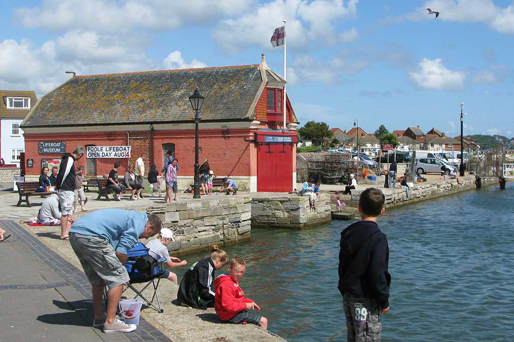 Crabbing at Poole Quay is always a popular pastime