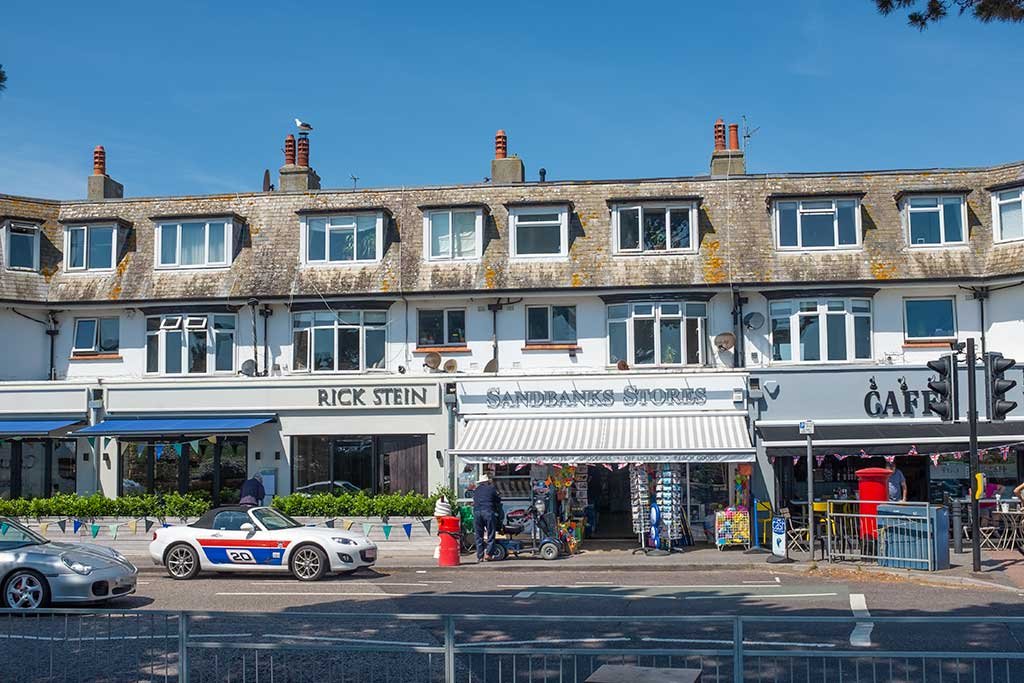Parade of shops opposite the main beach car park. You can find the excellent Rick Stein Restaurant here.