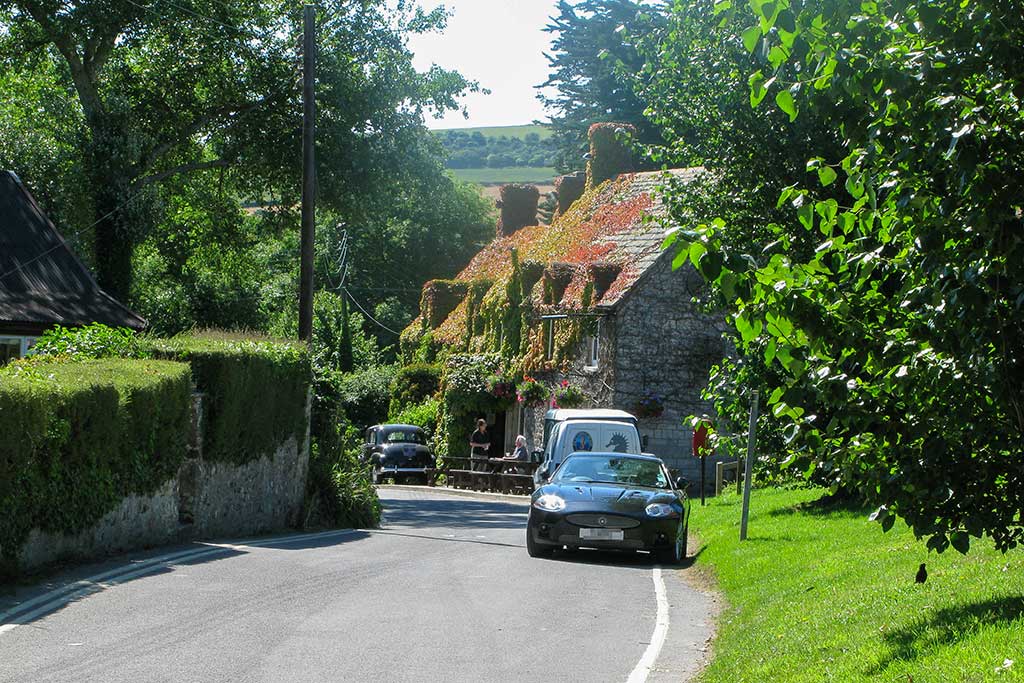 Studland Village. View from just outside the National Trust Car Park down towards the Bankes Arms Inn